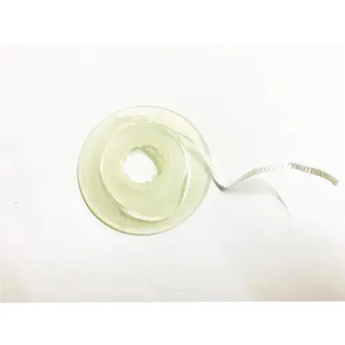 Spool of white braided fiber ribbon for splinting and restorations Bioloren Infibra Ribbond dental reinforcement