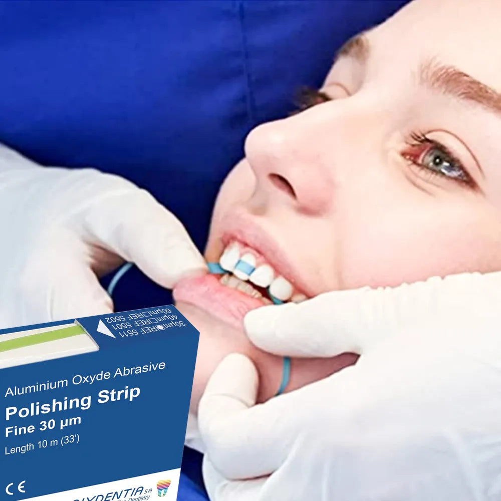 Dentist using Polydentia abrasive polishing strips to polish patient teeth with Beetle Dental box visible