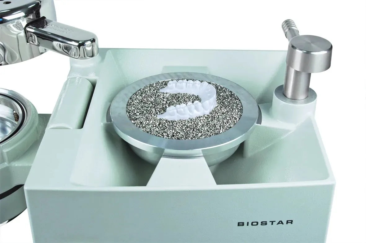 Biostar dental vacuum forming tray with dental model resting on Scheu stainless steel pellets 1 kg for lab thermoforming